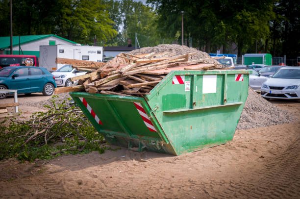 many wood waste is collected on a construction site in a green waste container
